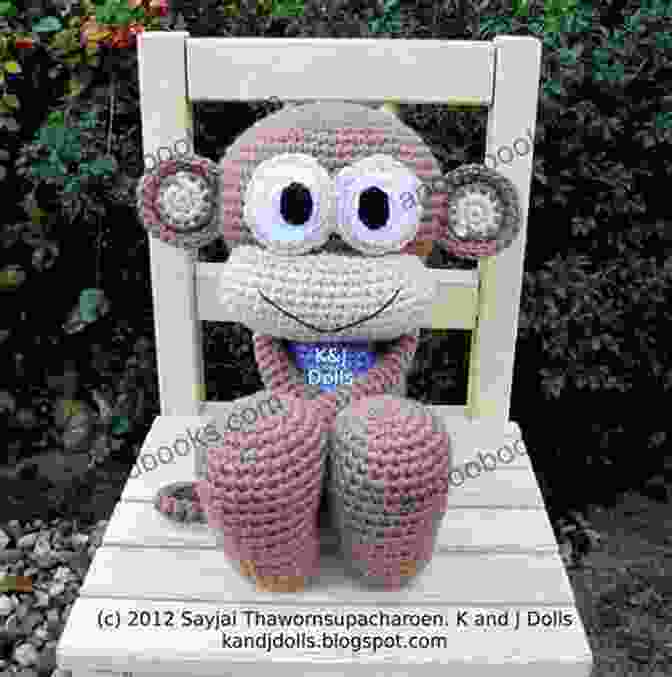 A Cute And Fluffy Huggy Monkey Amigurumi Doll Sitting In A Meadow, Surrounded By Colorful Wildflowers. Huggy Monkey Amigurumi Crochet Pattern (Big Huggy Dolls 3)