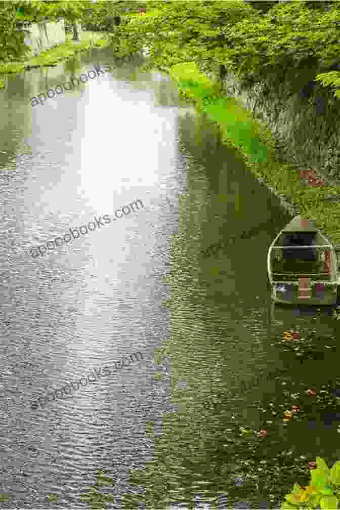 A Peaceful Canal Scene, Framed By Lush Greenery And Tranquil Waters. Around Britain By Canal: 1 000 Miles Of Waterways