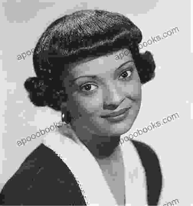 Barbara Culp McKinney, A Smiling Woman With Short Hair, Wearing A Black Dress And Pearl Earrings, Standing In Front Of A Bookshelf Pioneer Survivor Of Indian Attack: The Story Of Barbara Culp McKinney