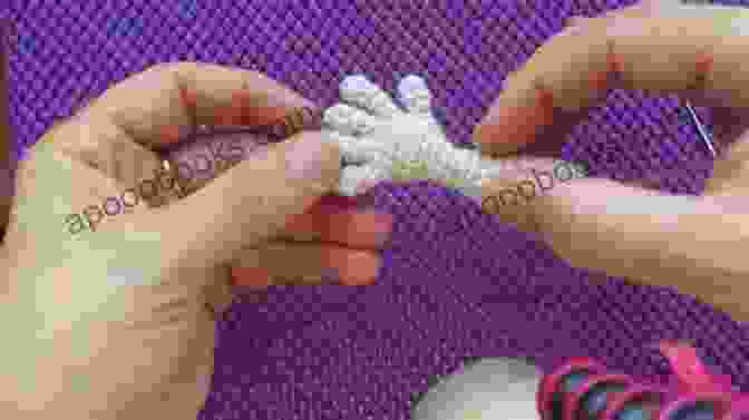 Close Up Of A Crocheter's Hands Working On An Amigurumi Doll, Highlighting The Clear And Detailed Tutorials Found In Easy Amigurumi: 28 Doll Patterns (Sayjai S Amigurumi Crochet Patterns 1)