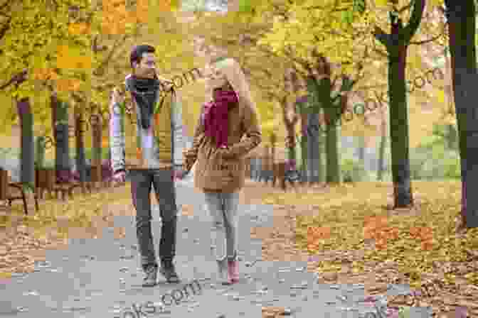 Couple Laughing And Holding Hands While Walking In A Park Real Love In Dating: The Truth About Finding The Perfect Partner
