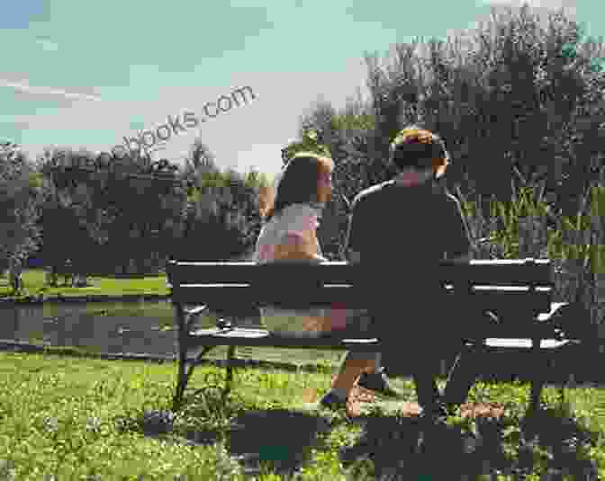 Couple Talking And Laughing While Sitting On A Park Bench Real Love In Dating: The Truth About Finding The Perfect Partner