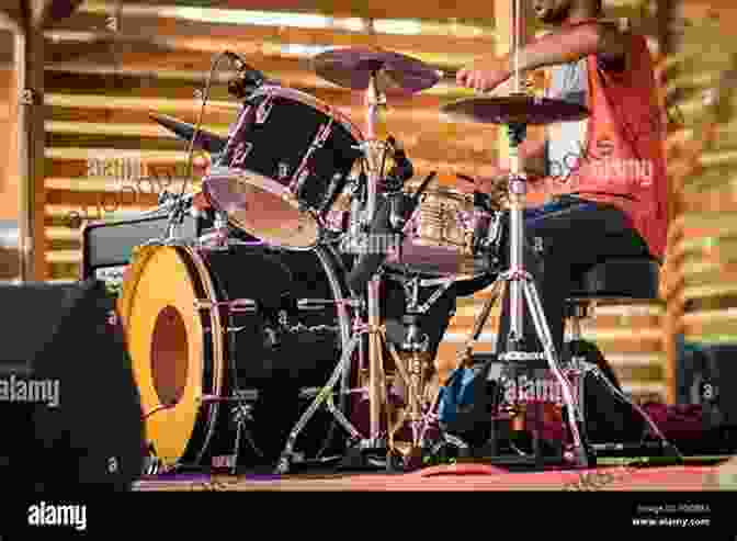 Drummer Performing On Stage In Front Of An Audience The Drummer: 100 Years Of Rhythmic Power And Invention